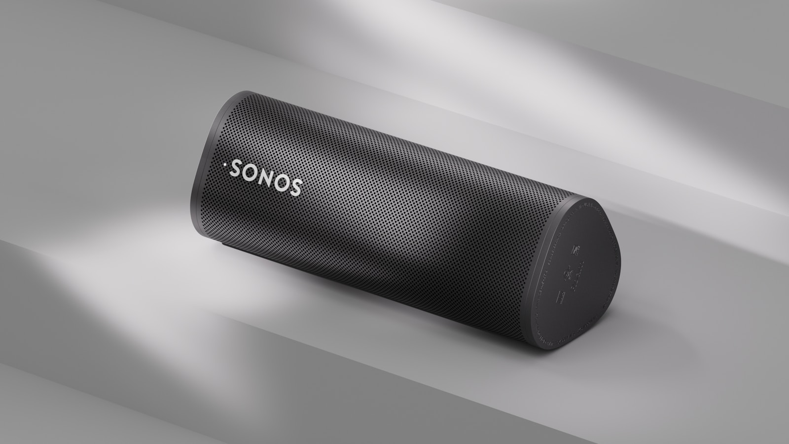 A sonos speaker sits angled on a surface.