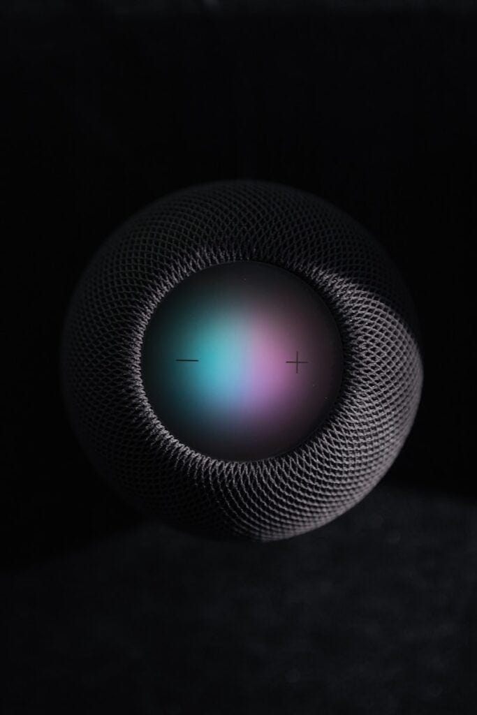 black and gray round portable speaker