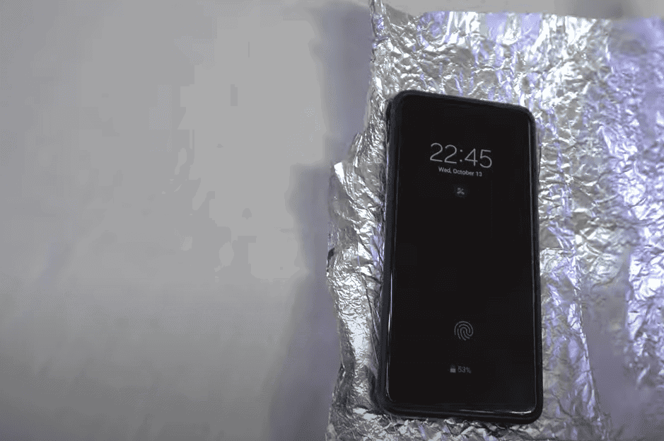 Phone wrapped in Aluminum Foil