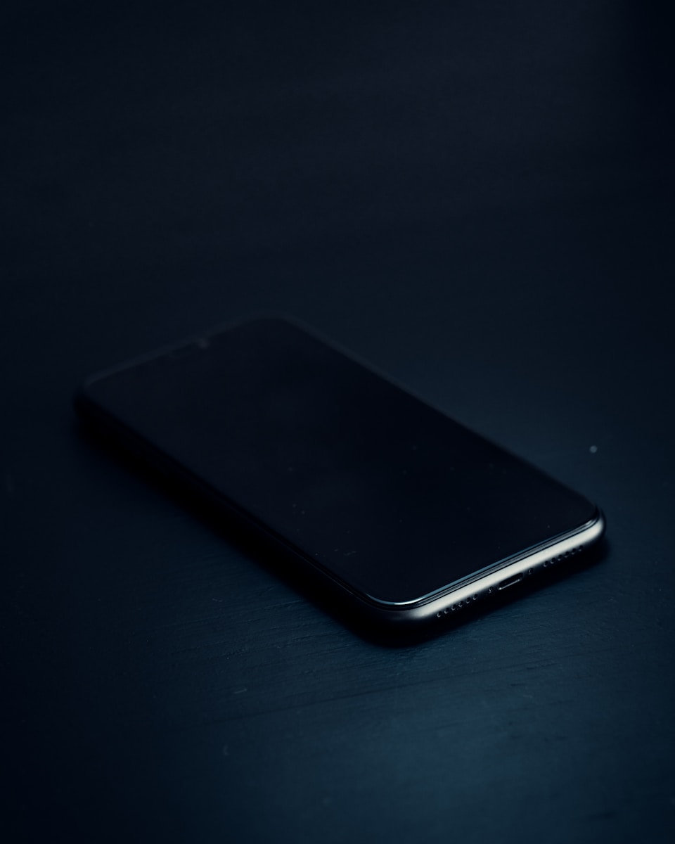 a close up of a cell phone on a table