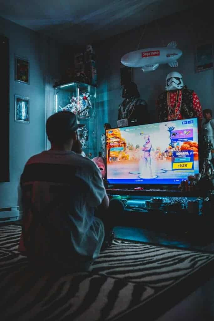 Fortnite man in red shirt watching tv