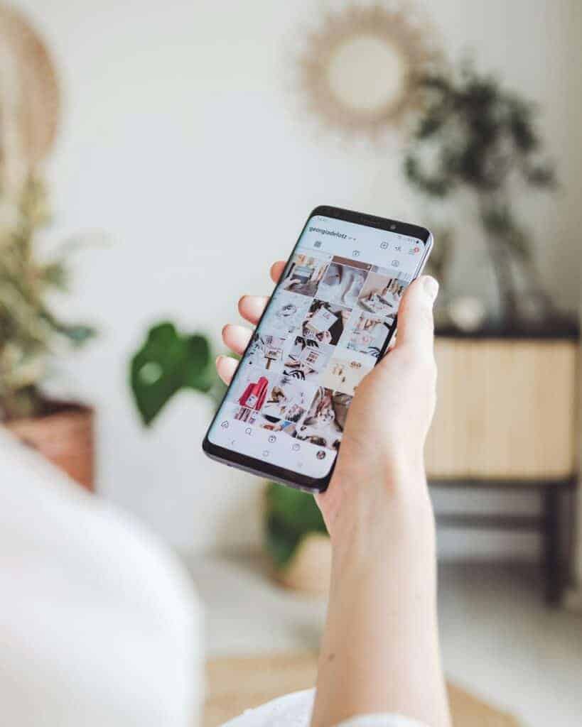 person holding white android smartphone